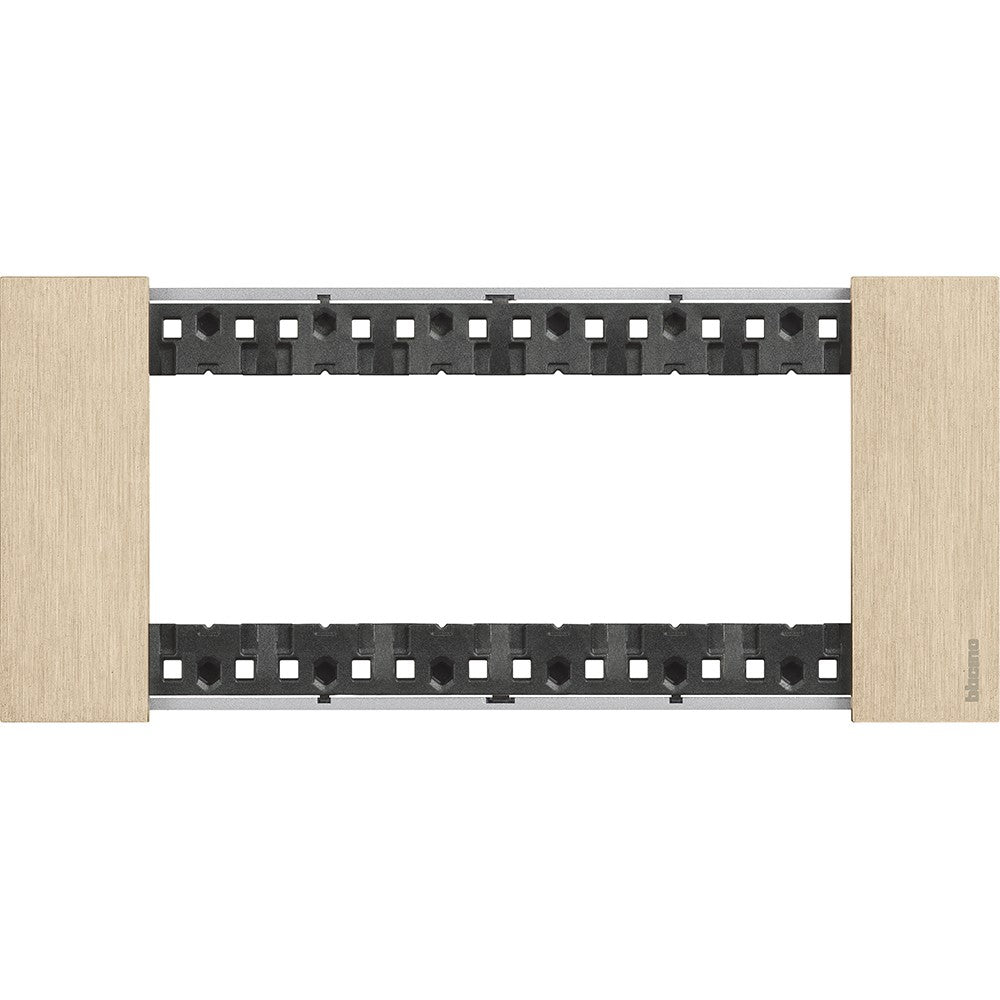 BTicino Living Now 6-moduli plate in gold finish, dimensions 86mm height x 192.5mm width, made of zama material.