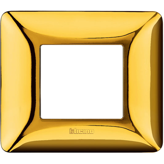 Placca Bticino Matix 2 moduli in oro lucido, misura 84mm x 96.2mm, realizzata in tecnopolimero.
